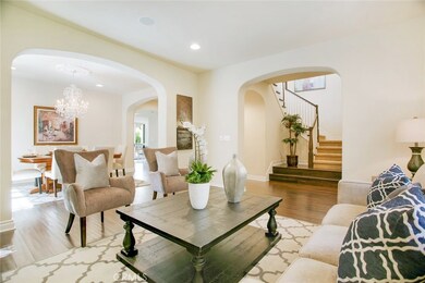 Open Floor Plan: Living Room looks over Semi Formal Dining Room
