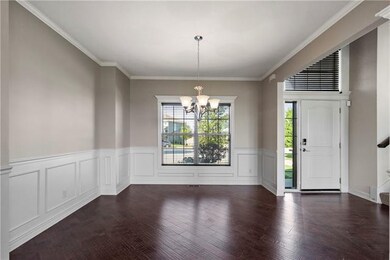 Dining room with hardwood floor and wainscoting