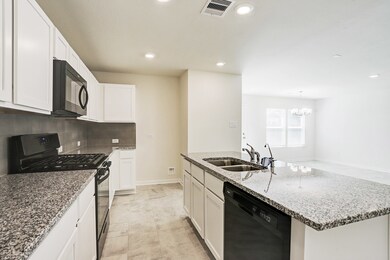The kitchen with gorgeous granite counter tops and