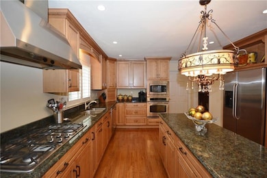 Stainless steel appliances and large kitchen islan