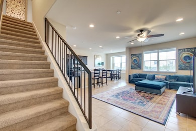 Living area featuring ceiling fan, recessed light