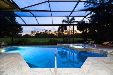 Pool at dusk with an outdoor pool, a patio, an in-ground hot tub, and a lanai