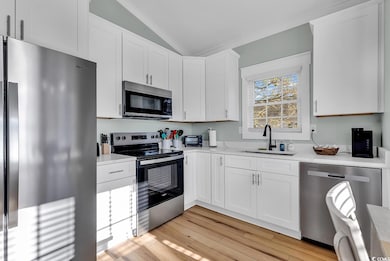 Kitchen with appliances with stainless steel finis