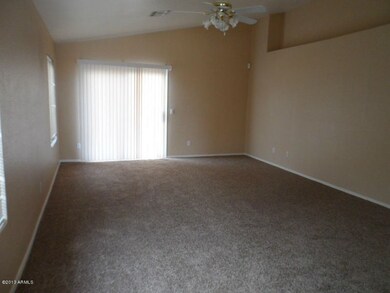 living rm w/ plant shelf & new carpet