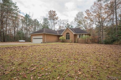 Ranch-style house featuring a garage