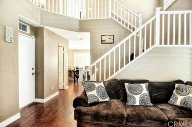 High baseboards and laminate wood floors downstair