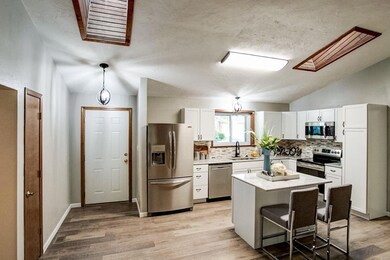 NEW FLOOR, APPLIANCES, CABINETS, COUNTERTOPS, BACK