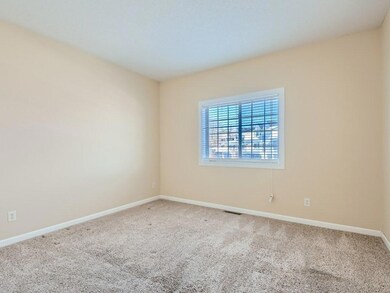 This bedroom is located off the kitchen area.