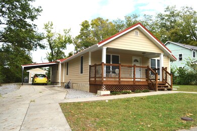 Exterior front with carport