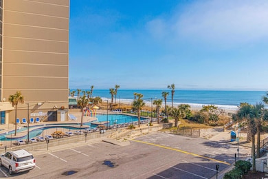 Exterior space featuring a view of the beach and a
