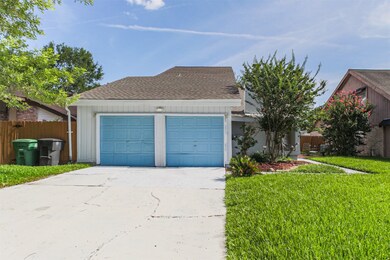 Another view of the front driveway with 2-car gara
