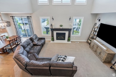 Complete with 2 story ceilings, a beautiful fireplace and seamless access to the Kitchen