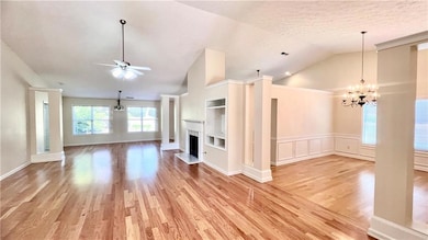 Unfurnished living room with a textured ceiling, v