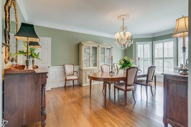 DINING ROOM LIGHT DOES NOT CONVEY- NEW ONE HAS BEEN PURCHASED. SAND/SEAL HARDWOOD FLOORS MILLWORK/CROWN MOLDING/WANSCOATING CHANDELIER IS ON A DIMMER/DINING ROOM LIGHT DOES NOT CONVEY/NEW LIGHT HAS BEEN PURCHASED CUSTOM PLANTATION SHUTTERS