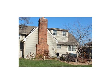 Manicured and landscaped front & back yard with a brick patio