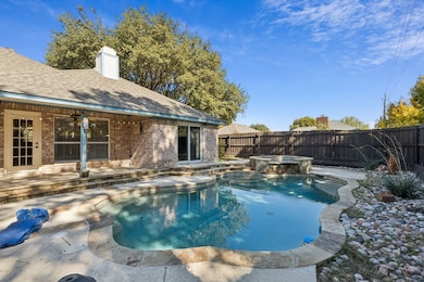 The backyard is an oasis with sparkling pool and spa, extended covered patio and the privacy of the wooden fence.
