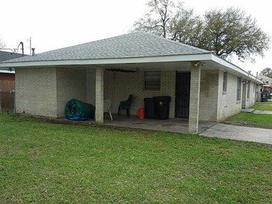 Facade/Exterior Front. Carport View