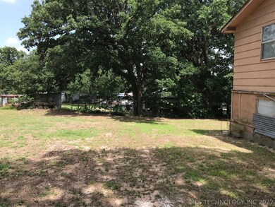 Yard to side of house.