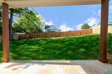 Fenced backyard featuring a patio area