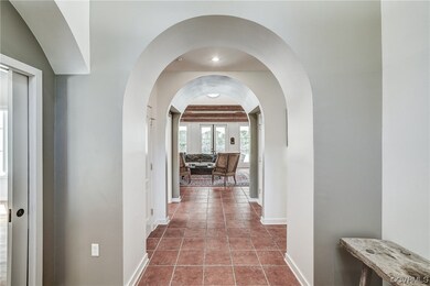 Hallway with tile flooring