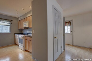 Bright Entry and well lit kitchen