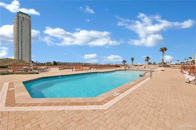 Community pool featuring a patio area