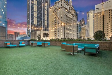 Surrounding community with a lawn and outdoor loun