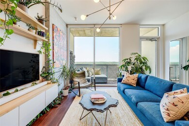 Living room featuring expansive windows and dark 