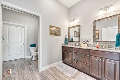Master Bad with two sinks and separate lavatory an