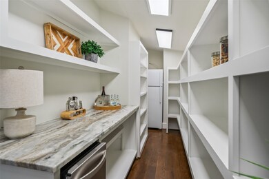 Next to kitchen is an extended pantry w extra frid
