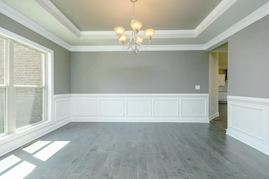 Spare room with healthy amount of natural light, a