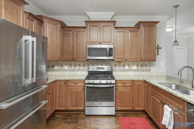 Top-of-the-line appliances such as a gas stove/oven. Additionally, you'll find a built-in 'vented' microwave and a whisper-quiet, high-end dishwasher, ensuring a seamless and enjoyable cooking experience.