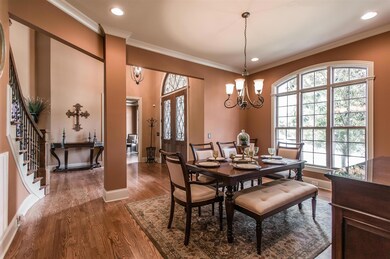 Formal Dining Room- 17x13 with Hardwood floor, Triple windows with Arched Transom, Recessed Lighting, Chandelier and Open Entry.