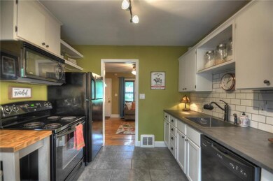 Extra wide galley style kitchen with white cabinet