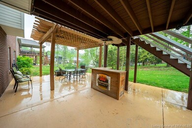 Sprawling partially covered patio with pergola....