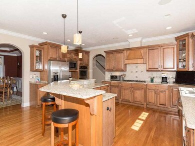 Kitchen. Chef s kitchen w/ center island, stainless steel appliances, and tons of storage space