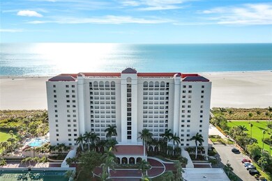 View of building exterior featuring a beach view a