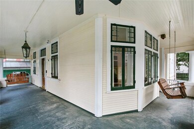 Enjoy this fantastic wrap around porch with 2 porc