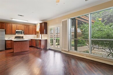 Open kitchen and living room with large windows to