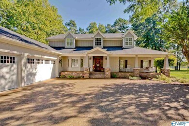The covered porch with beadbord ceiling and porch swing will be a warm welcome for all of your guests!