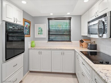 Note the wall oven and  stove top. Lots of cabinet
