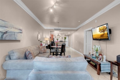 Living area featuring visible vents, track lightin