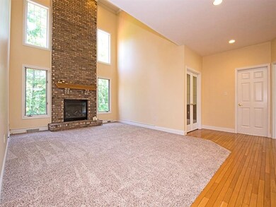 The Family Room sports a two story fireplace flank