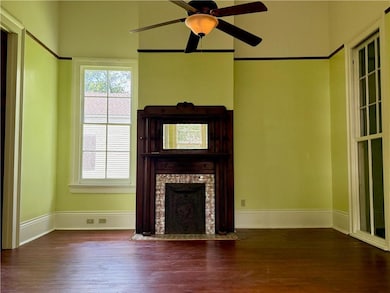 The formal living room boasts historic features su