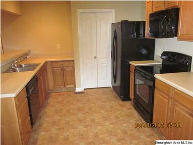 Kitchen has oak cabinets and a full complement of 