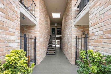 The stairs leading up to the second-floor unit.