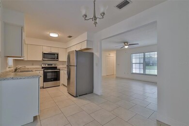 Dining Room w/ View into Kitchen