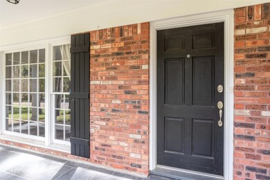 Front door with covered front porch.