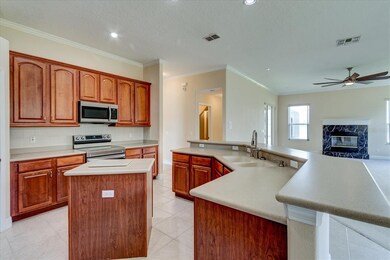 The kitchen features a center island for extra spa
