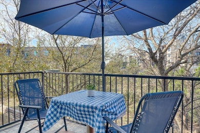 Balcony featuring a sunroom